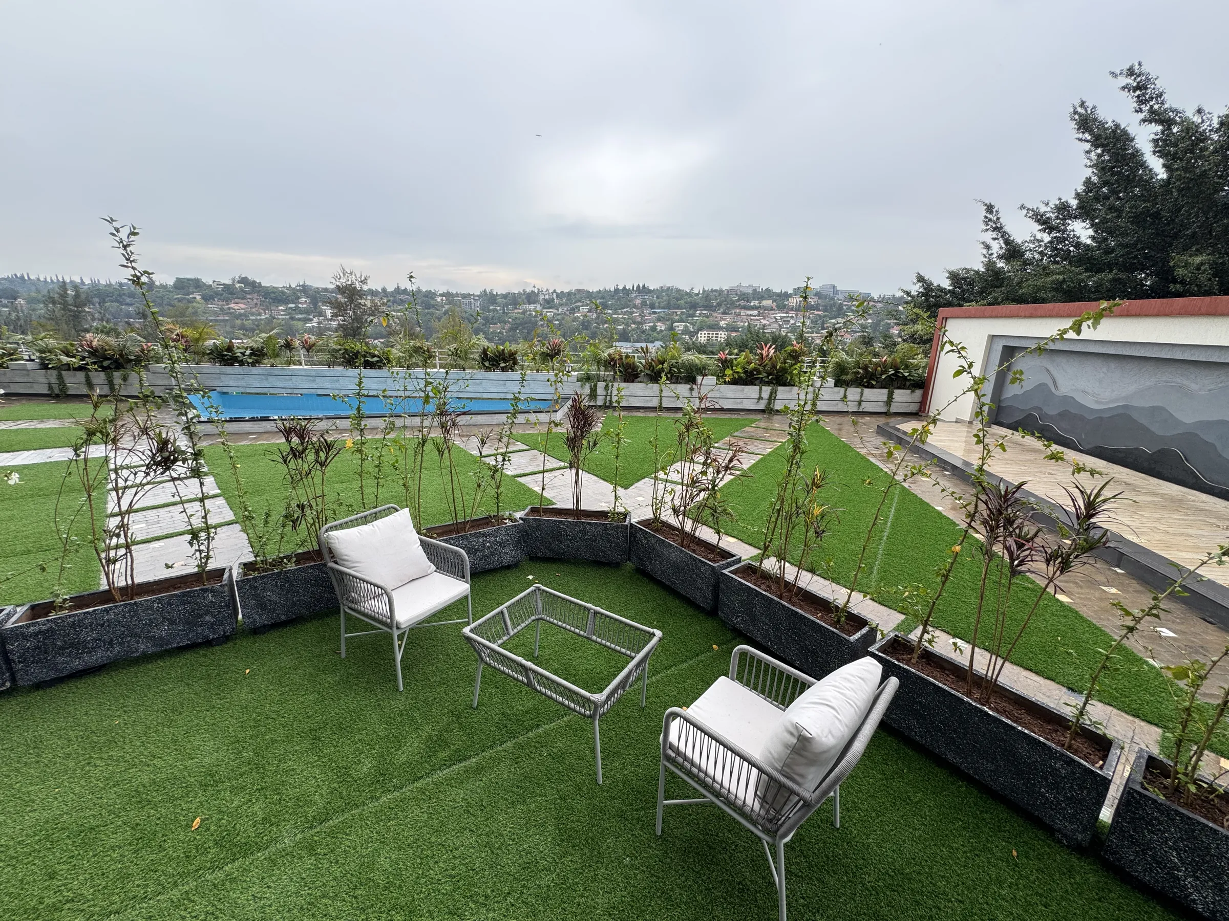 Rooftop terrace with lawn and outdoor seating